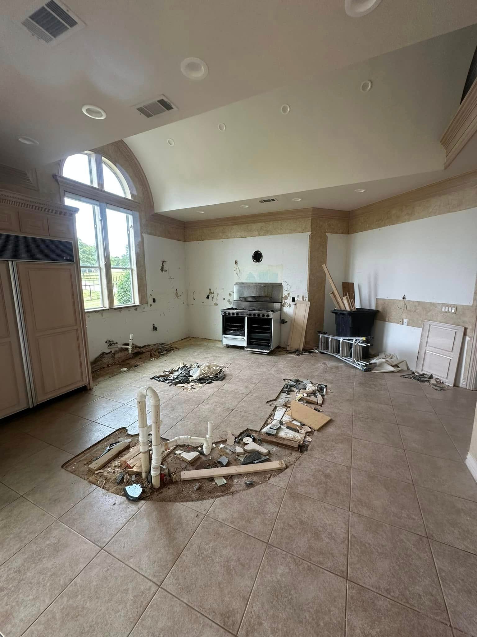 Kitchen floor out around exposed plumbing, JS Company LLC job